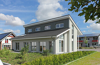 ECO System HAUS – Pultdachhaus mit grauem Stein und grauem Dach